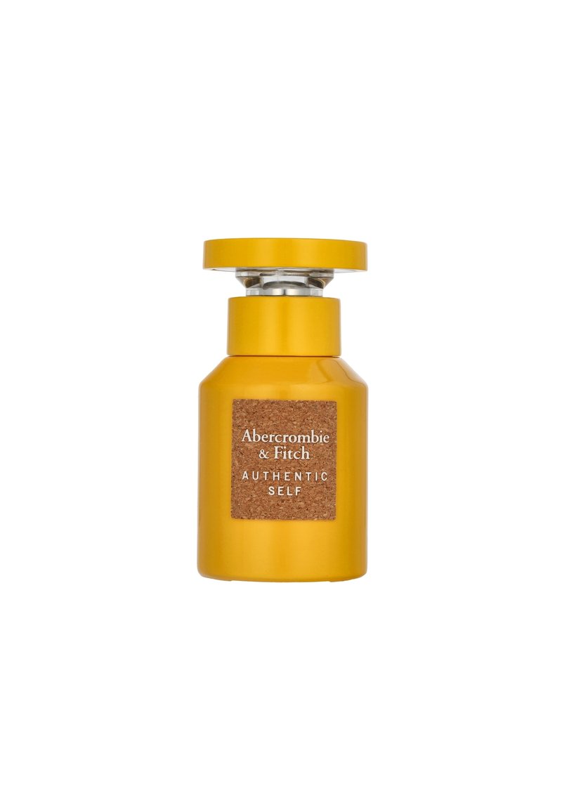 Gelbes Glasparfümfläschchen mit runder Kappe, ausgestattet mit einem rechteckigen Korketikett, auf dem "Abercrombie & Fitch" und "Authentic Self" in weißer Schrift steht.