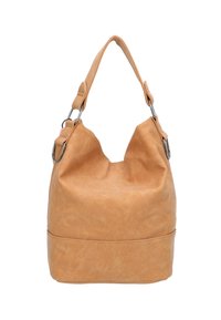 Borsa a spalla in suede beige con manico largo e anelli in argento, forma morbida e slouchy, con fondo arrotondato su sfondo bianco.