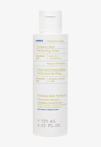 Hvid cylindrisk flaske med flip-top låg, mærket "Korres Poreless Skin Perfecting Toner," med gul og grå tekst. Størrelse 125 mL.