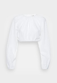 Blusa branca cropped com mangas longas bufantes, feita de tecido texturizado com bordado de ilhós. Decote franzido e bainha elástica.
