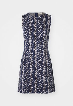 Rochie fără mâneci din material bleumarin, cu un model în zigzag crem, guler rotund și închidere cu fermoar la spate. Siluetă în formă de A.