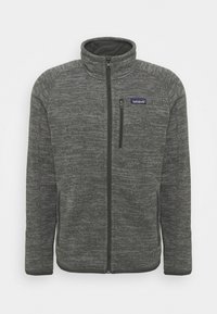 Veste en polaire grise avec un col montant, une fermeture éclair sur toute la longueur et des poches latérales. Présente un motif texturé et un petit logo de la marque sur la poitrine.