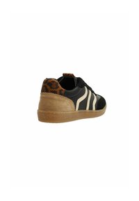 Black and tan sneaker featuring a textured upper, cream stripes, and a leopard print accent on the heel. Rubber sole with a beige finish.