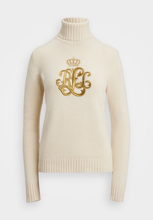 Kremni pleteni pulover s turtleneck ovratnikom in dolgimi rokavi, okrašen z zlatim vezenim monogramom in dizajnom krone na prsih.