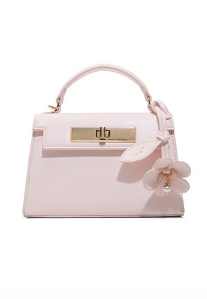 Light pink small handbag with top handle, gold clasp, and a decorative flower charm with pearl detail on the right side.