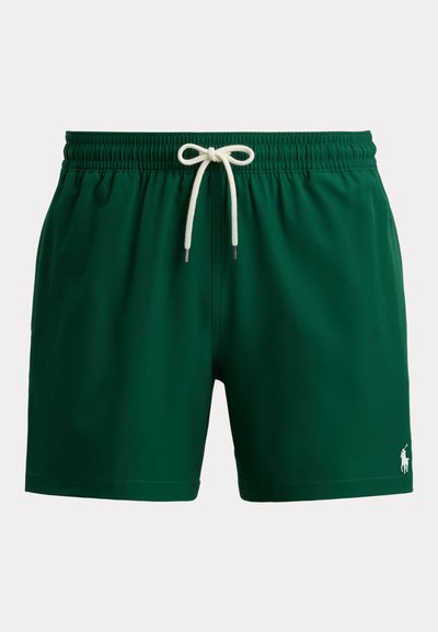Short de bain vert foncé avec taille élastique, cordon blanc et petit logo Polo blanc sur la partie basse de la jambe gauche.
