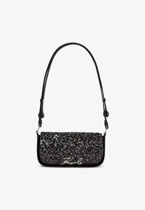 Black handbag with a textured, sequined surface and silver logo. Features a sleek design with an adjustable strap for versatility.