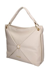 Borsa beige con una parte frontale testurizzata, caratterizzata da un motivo a diamante, accentuata da un anello dorato e accessori in metallo. Materiale morbido e manico curvo.