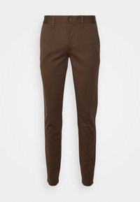 Pantalon marron ajusté en tissu lisse et extensible. Doté d'une taille à boutons et d'un design épuré et près du corps. Style simple et minimaliste.