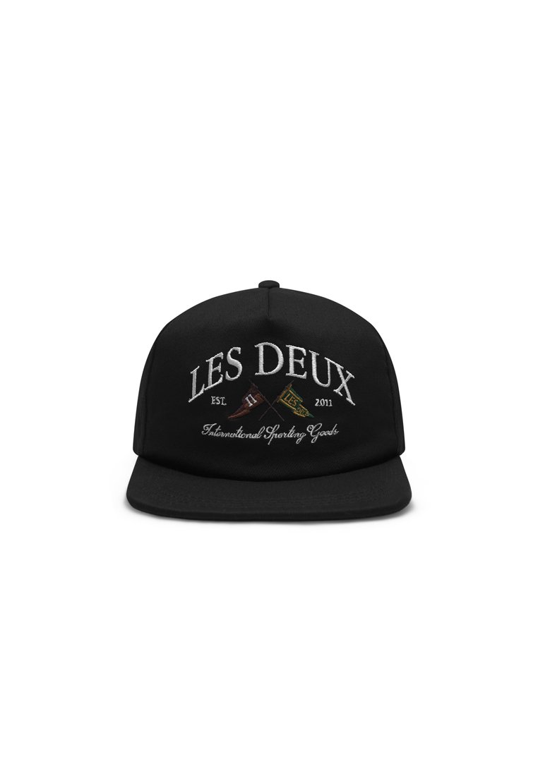 Black cap featuring embroidered text "LES DEUX" and "Est. 2011" in white, with decorative elements. Stiff brim and adjustable strap at the back.