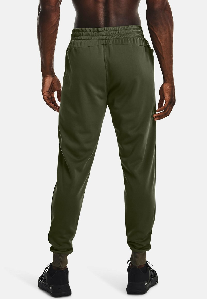 Pantalons de survêtement verts avec une taille élastique, des poignets fuselés et des poches latérales, fabriqués à partir d'un matériau lisse et respirant.