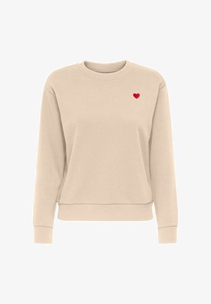 Sweat-shirt beige à col rond avec des manches longues et un petit cœur rouge brodé sur le côté gauche de la poitrine.