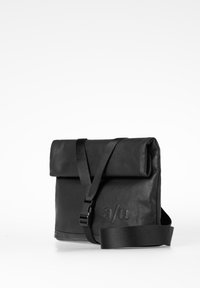 Black leather messenger bag with adjustable strap, roll-top closure, embossed logo, and smooth texture. Compact rectangular design.