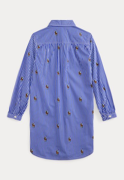 Cămașă cu mâneci lungi, cu dungi verticale albastre și albe, având mici figuri brodate. Prezintă un guler standard și manșete cu nasturi.