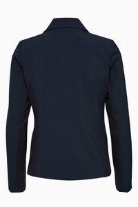 Navy blue jacket with a tailored design, featuring a structured collar and contrasting side panels. Smooth texture and fitted shape.