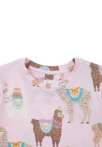 Light pink short-sleeve shirt featuring cartoon llamas with colorful saddle patterns. Soft fabric with a crew neckline and subtle texture.