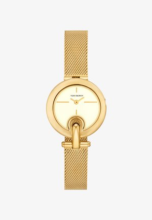 Kulta-sävyinen verkko rannekello, jossa on pyöreä kellotaulu, vaaleankeltainen kellotaulu, minimimaliset tuntimerkit ja Tory Burch -logo.