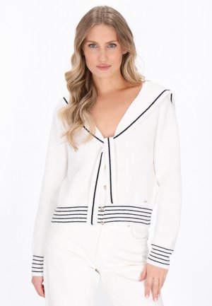 White knitted cardigan featuring a sailor collar, black stripes at the cuffs and hem, and gold-tone buttons down the front.