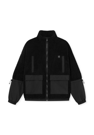 Black fleece jacket with a high collar, zip closure, and two front patch pockets. Features contrasting black fabric sleeves and adjustable cuffs.