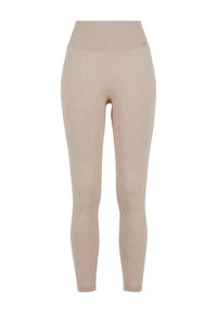 Leggings côtelés beiges avec une taille haute, présentant une texture douce et un design épuré. Pas de motifs visibles ni de détails en métal.