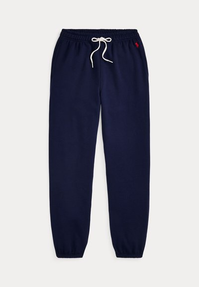 Σκουρό μπλε παντελόνι φόρμας από απαλό βαμβακερό μείγμα. Διαθέτει ελαστική μέση με λευκό κορδόνι και ριμπ τελειώματα. Μικρή κεντημένη λογότυπος.