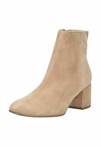 Stivaletto in suede beige con punta rotonda e tacco a blocco. Texture liscia, design semplice e cerniera laterale per un facile accesso.