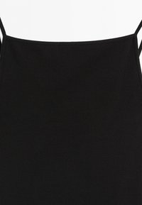 Black sleeveless square-neck tank top with thin straps made of ribbed fabric.