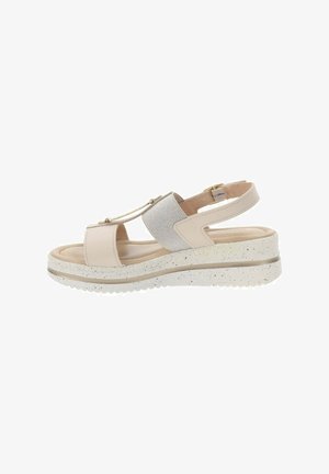 Sandal in beige e argento da donna con due ampie cinghie, cinturino alla caviglia regolabile, tomaia testurizzata e suola a zeppa maculata.
