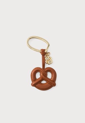 Brown leather pretzel-shaped keychain with gold clasp and small gold double-B charm on plain white background.