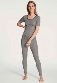 Gray fitted top with short sleeves and a scoop neckline, paired with matching gray leggings. The fabric appears soft and stretchy.