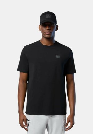 Black short-sleeve t-shirt made of smooth fabric with a round neck, featuring a textured logo patch on the chest. Paired with a matching black cap.