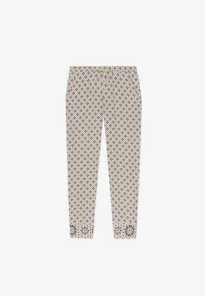 Pantalons beiges à motif avec un design en forme de diamant, dotés d'une taille à cordon et d'accents floraux au bord. Fabriqués à partir d'un tissu doux et texturé.
