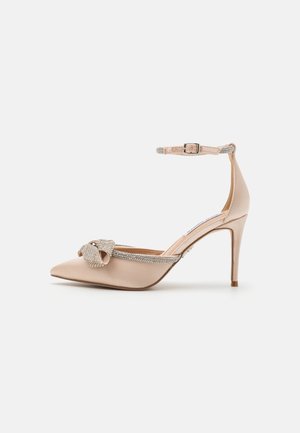 Højhælede pumps - nude