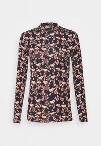 Långärmad topp tillverkad av stretchigt material, med en mörk marinblå bakgrund och små rosa och röda blommönster överallt.