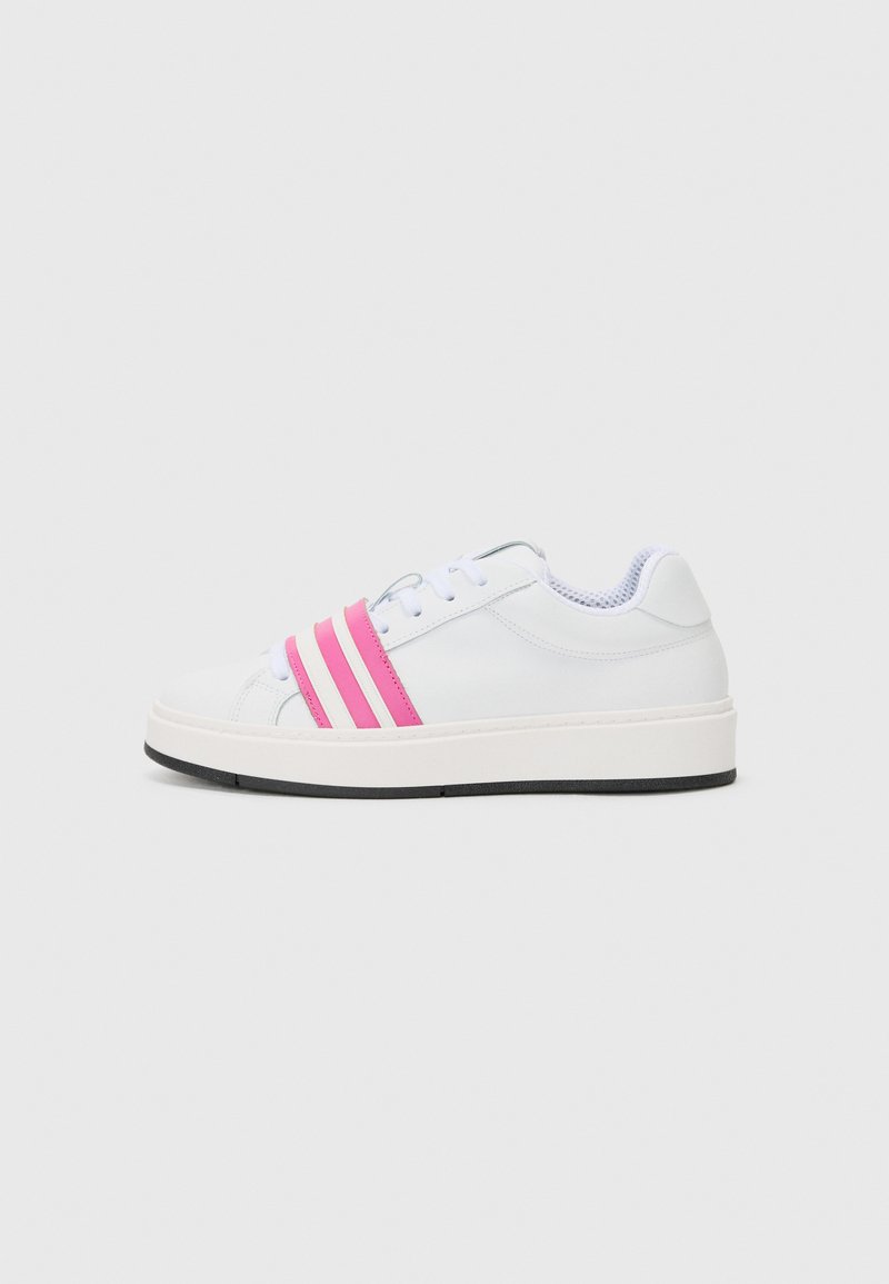 White sneaker with three pink stripes, textured leather upper, round toe, white sole with a black rubber bottom, and lace-up design.