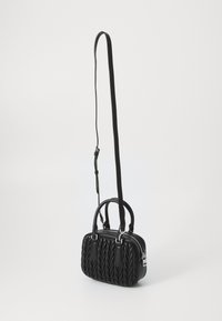 Black leather handbag with woven texture, dual short handles, and a detachable long strap. Features silver-toned zipper and accents.
