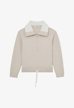 Béžový pulóver s bielym rebrovaným golierom, polovičným zipsom a nastaviteľným sťahovaním na spodnom okraji. Mäkká, hladká textúra s dlhými rukávmi.