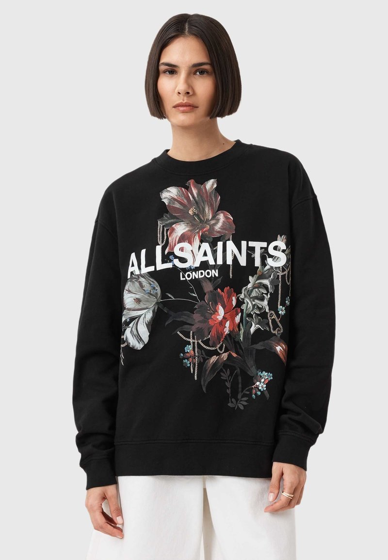 Fekete pulóver virágos grafikai tervezéssel piros, fehér és zöld színben, az elülső oldalon "ALLSAINTS LONDON" felirattal. Puha anyag, laza szabás.