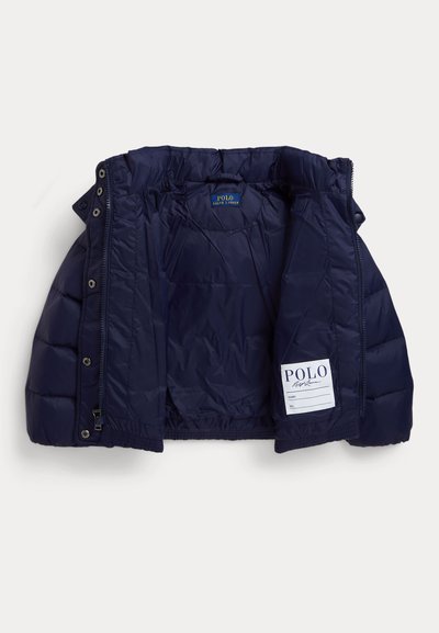 Navy blue insulated puffer jacket with a smooth exterior, quilted texture, elastic hem, and inner label; features snap closures on front.