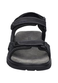 Sandal nera con cinturini regolabili in Velcro, soletta grigia imbottita e suola in gomma resistente. Dettagli cuciti sui cinturini.