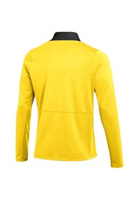 Camicia a maniche lunghe di un vivace giallo con colletto nero. Realizzata in tessuto leggero e morbido con un design semplice e uniforme.
