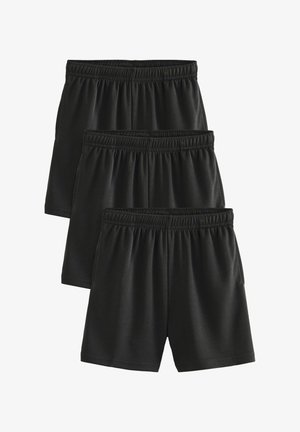 Trzy pary czarnych sportowych spodenek z elastycznymi pasami, nałożone na siebie i ułożone warstwowo na białym tle.