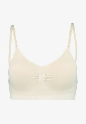 Fény bézs, varrás nélküli melltartó, puha tapintással és állítható pántokkal. Középső ráncolt részletekkel és drót nélküli kialakítással rendelkezik.