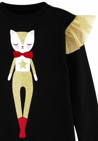 Sudadera negra con un diseño de gato en purpurina dorada, con un lazo rojo, un acento de estrella y volantes dorados en un hombro.