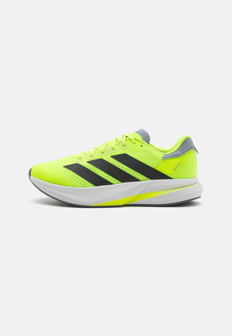 Neon yellow running shoe with a mesh upper, black three-stripe design, gray accents, and a white sole featuring a colored stripe.