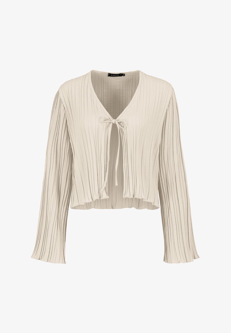 Light beige cropped blouse with long sleeves, featuring vertical pleats and a tie closure at the neckline. Soft, textured fabric.