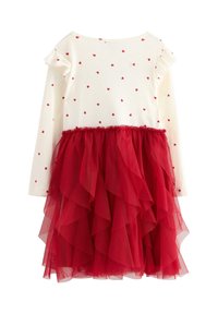 Rotes Tüllkleid mit einem weißen, gerippten Oberteil, das kleine rote Herzmuster und Rüschenshculden aufweist. Der Rock hat mehrere geschichtete Rüschen.