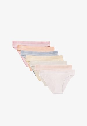 Sept culottes en coton pour femmes aux couleurs pastel empilées en éventail, montrant des nuances de rose clair, pêche, bleu, crème et blanc.
