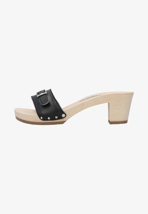 Black leather slide sandal with a wide strap and a metal buckle, set on a light wood platform sole with a chunky heel. Decorative studs present.
