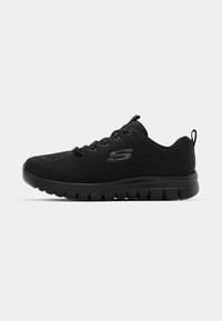 Schwarzer Skechers Sport-Sneaker mit Schnürdesign, gepolsteter Sohle und Zuglasche an der Ferse, seitlich auf einem weißen Hintergrund abgebildet.